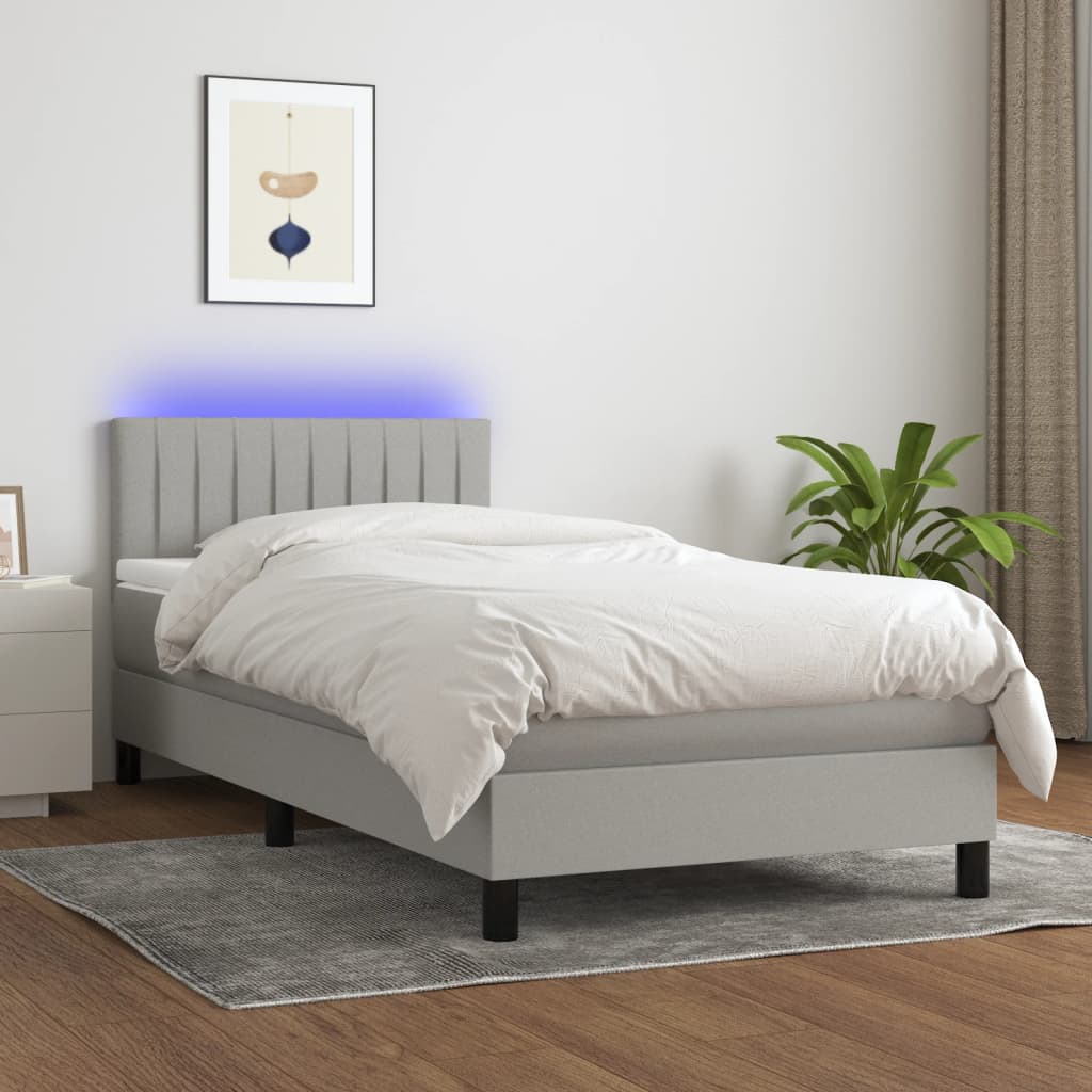 Boxspring met matras en LED stof lichtgrijs 90x190 cm